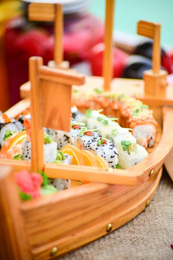 pexels-photo-20791759-20791759 A beautifully arranged sushi platter in a wooden boat, showcasing vibrant colors and fresh ingredients, perfect for Japanese cuisine lovers.